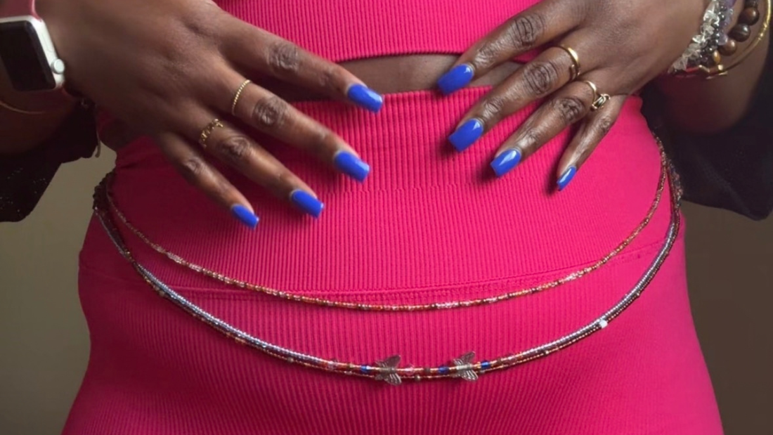 traditional tie on luxury waist beads shown on a plus size body. 